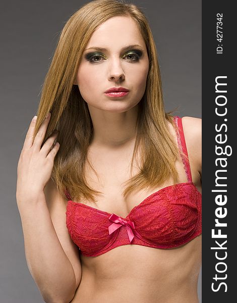 Beautiful blonde model wearing pink bra. Beautiful blonde model wearing pink bra