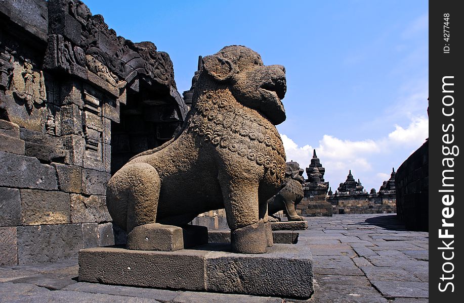 Indonesia, Java, Borobudur: the temple guardians; stone seated lions statues representing the guards and protectors of the temple. Indonesia, Java, Borobudur: the temple guardians; stone seated lions statues representing the guards and protectors of the temple