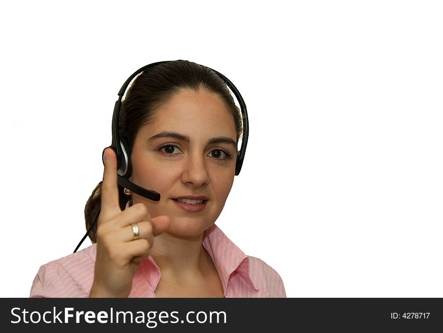 A girl, wearing headphones with microphone, pointing her index finger up. A girl, wearing headphones with microphone, pointing her index finger up