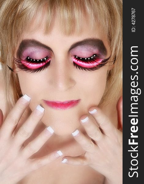 Beautiful 40 year old woman in artistic make-up with manicure. Beautiful 40 year old woman in artistic make-up with manicure.