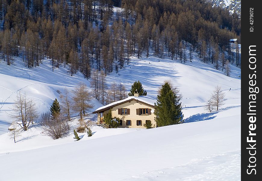 Challet between the snowy Swiss Alps