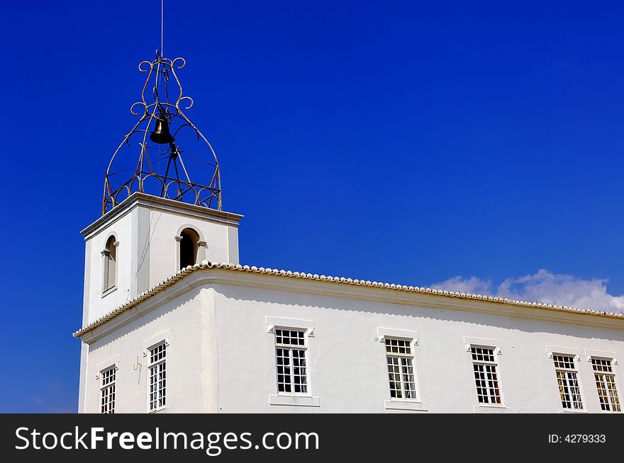 Portugal, area of Algarve, Albufeira: typical religious architecture. blue sky and detail of a white  church. Portugal, area of Algarve, Albufeira: typical religious architecture. blue sky and detail of a white  church