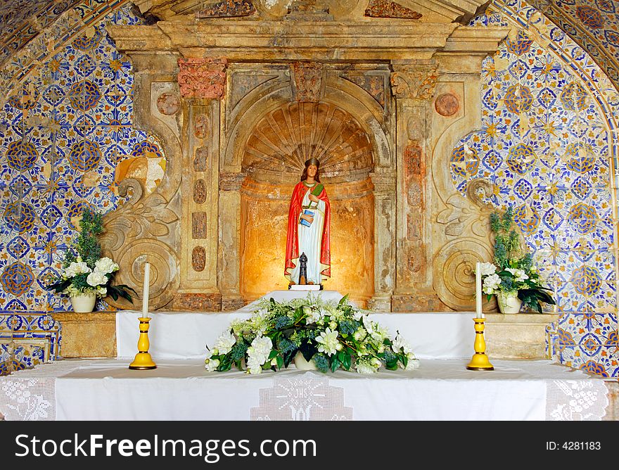 Portugal, Algarve, Lagos: Church in the Fortress, altar representing a holy image of Mari with the traditional blue and white wall ceramics , azulejos