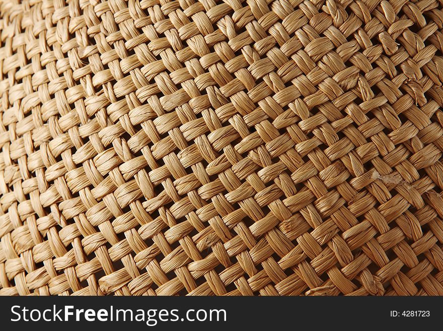 Close up view of a straw hat for use as a background. Close up view of a straw hat for use as a background