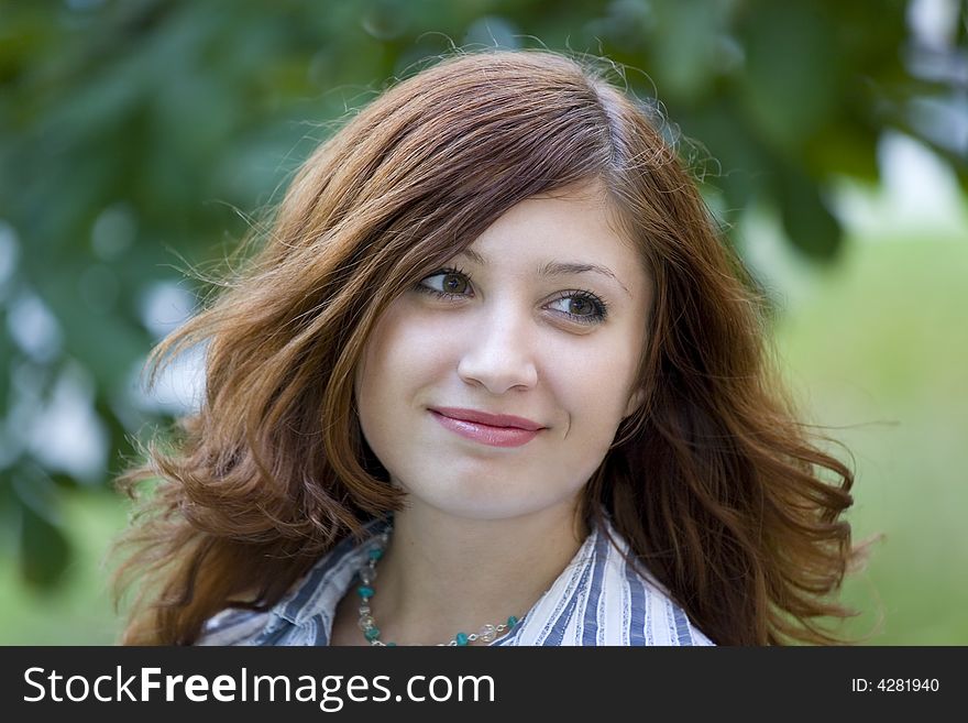 Beauty brunette in a park