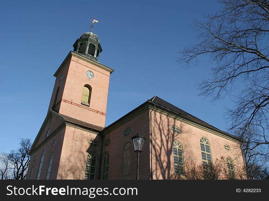 A old rococo brick church in winter time, Kongsberg Nroway