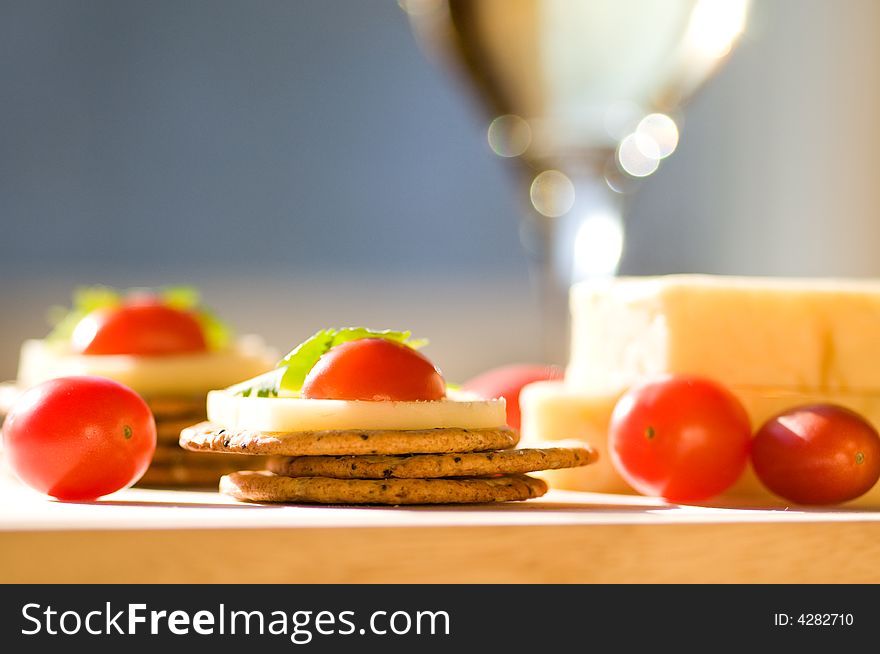 Cheese and crackers on a cutting board. Cheese and crackers on a cutting board