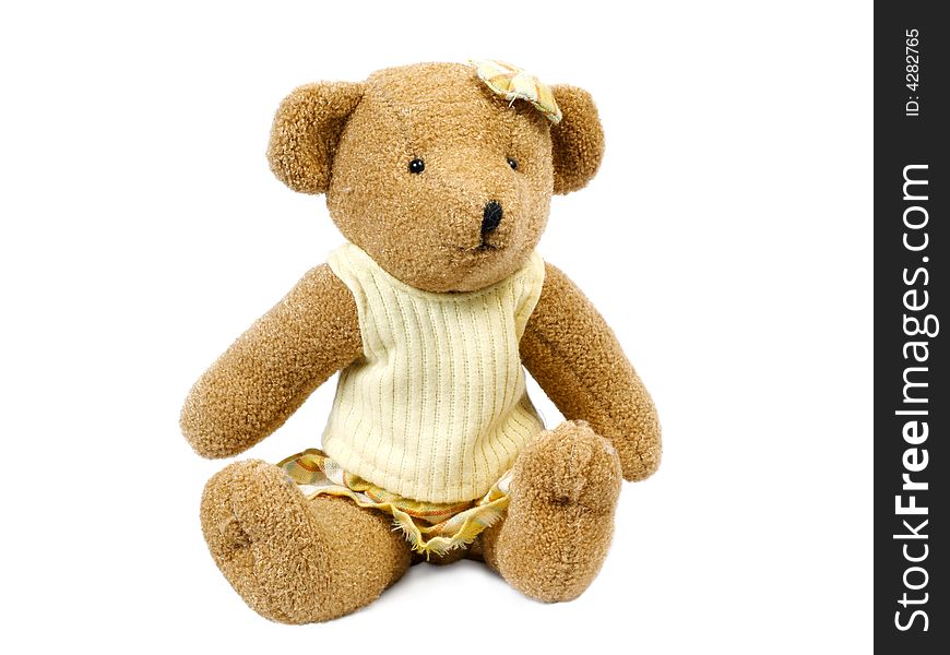 Dressed teddybear girl isolated on white background