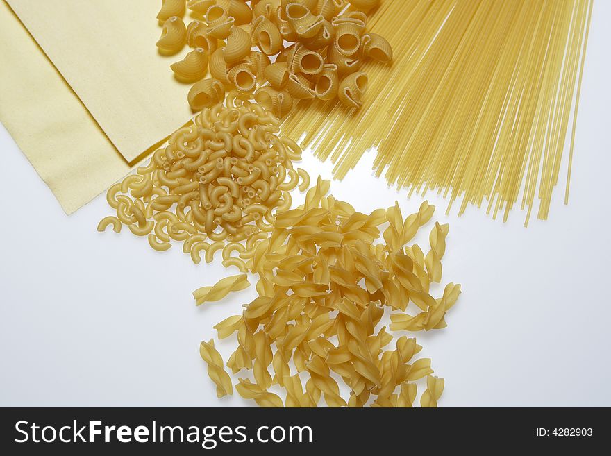 Variety of pasta on a white background