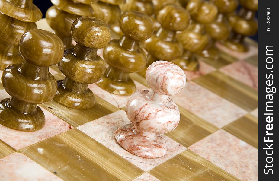 Against all odds - Chess pieces isolated on white