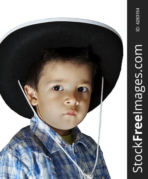 A little boy with a cowboy's hat. A little boy with a cowboy's hat