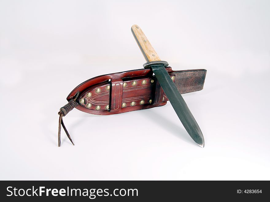 Bowie dagger and leather sheath in still life. Bowie dagger and leather sheath in still life