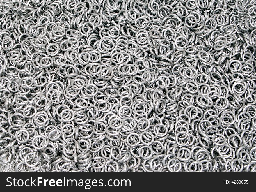 Rings for making chain mail, background, texture, pattern