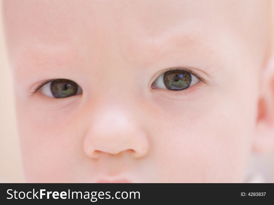 Serious baby face. Eyes close-up