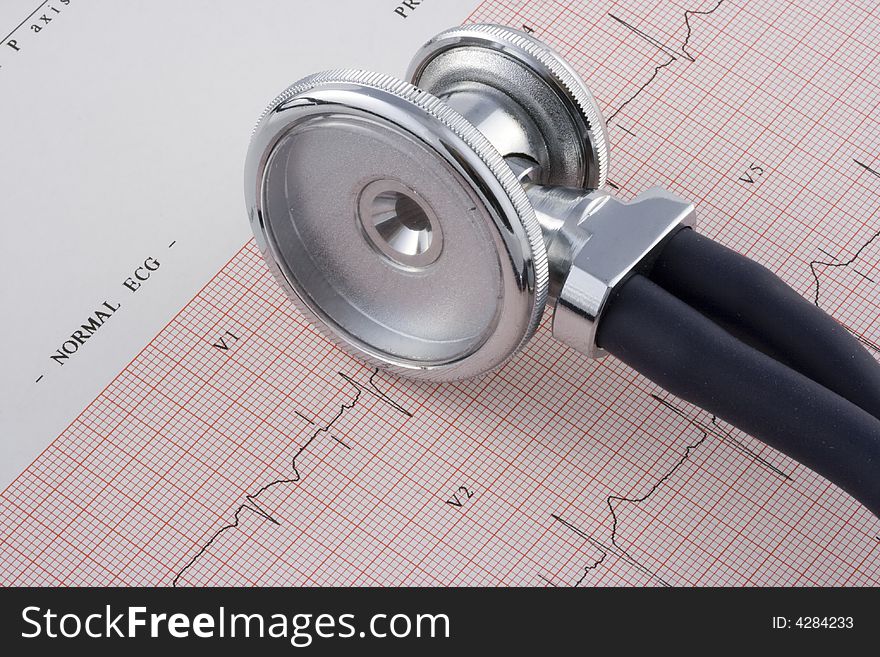 Closeup of an EKG chart and a stethoscope. Closeup of an EKG chart and a stethoscope.