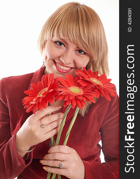 A green-eyed woman in red with red flowers