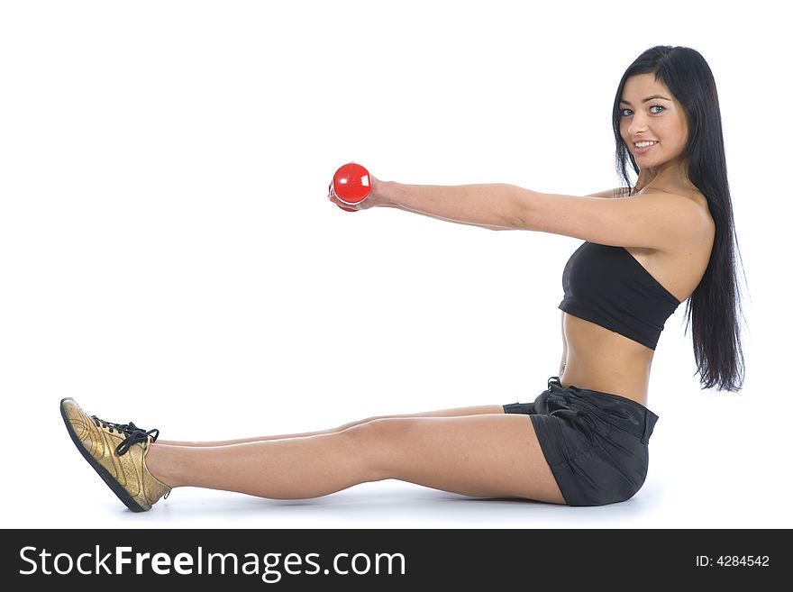 Beautiful girl with dumbbells on  isolated background
