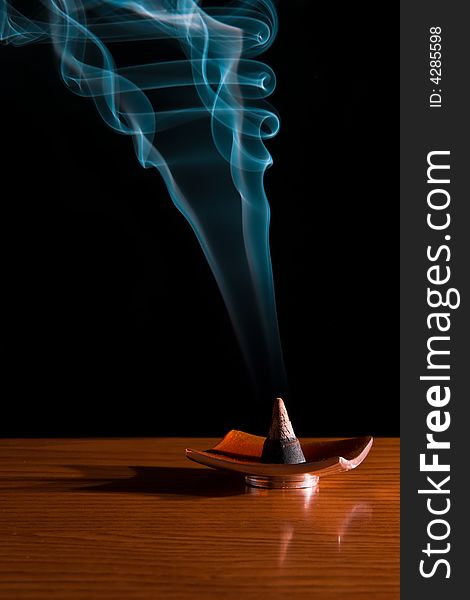 Incense smoke in a dark room. Calm and relax sensation. Incense smoke in a dark room. Calm and relax sensation.