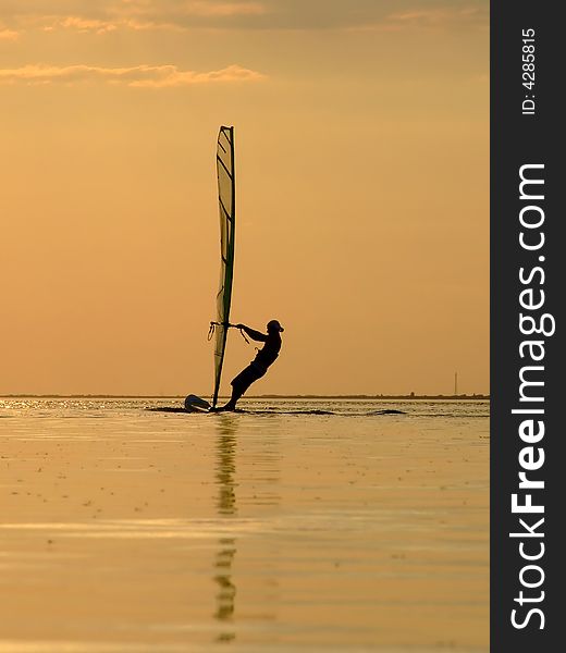 Silhouette Of A Wind-surfer On A Sunset 1