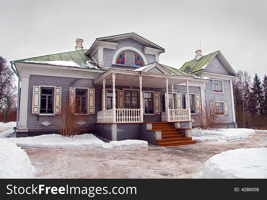 The big rural house in cloudy winter day