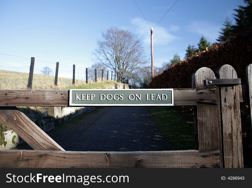 Sign at Kildrummy castle telling dog owners to keep them on a lead. Sign at Kildrummy castle telling dog owners to keep them on a lead