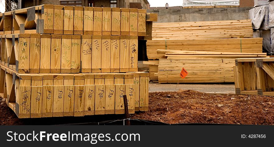 Wood roof trusses at a construction site for building apartments or condos. Wood roof trusses at a construction site for building apartments or condos