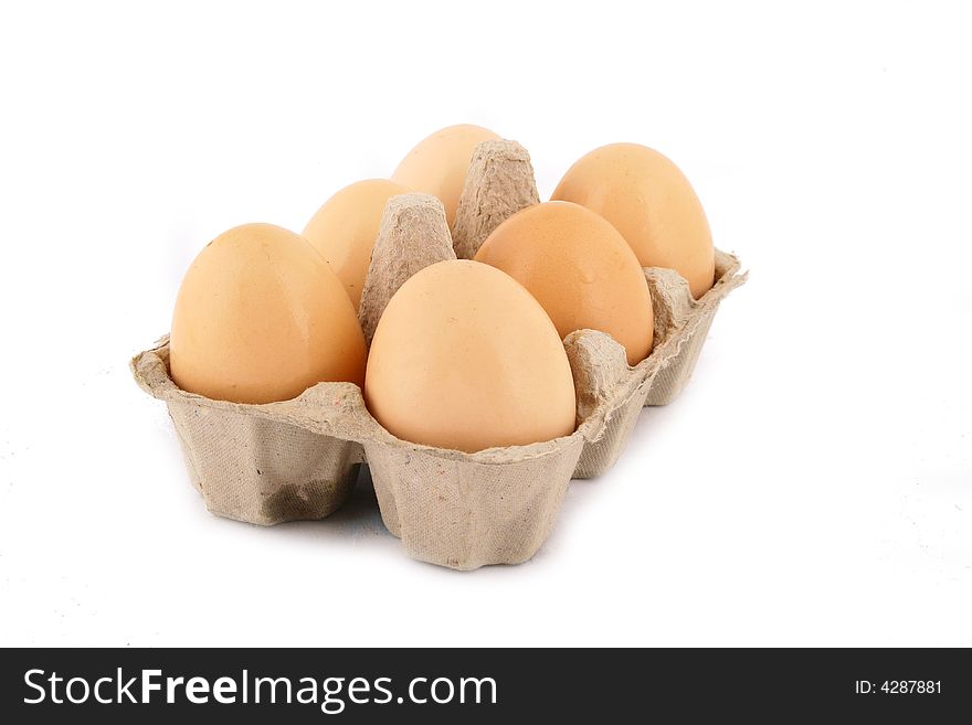 Brown eggs against a bright white background