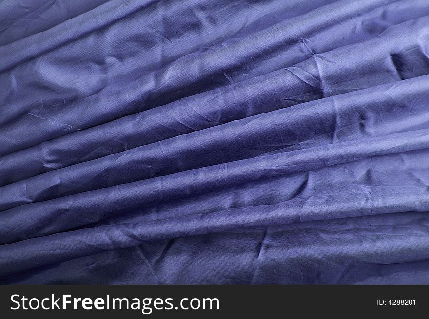 Abstract background blue silk fabric with waves. Abstract background blue silk fabric with waves