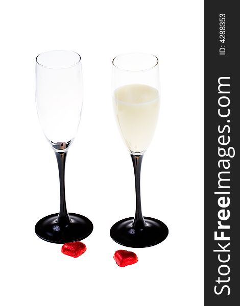 Two glasses with alcohol and red hearts (isolated)