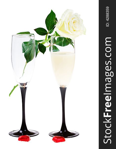 Two glasses with a rose and red hearts (isolated)