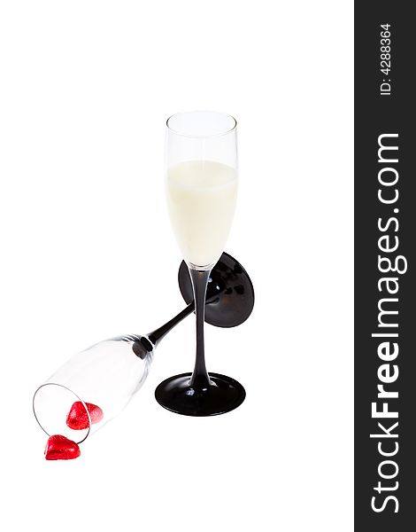 Two glasses and red hearts on a white background (isolated). Two glasses and red hearts on a white background (isolated)