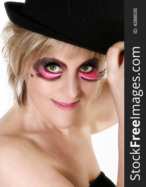 Beautiful 40 year old woman in artistic make-up and hat. Beautiful 40 year old woman in artistic make-up and hat.