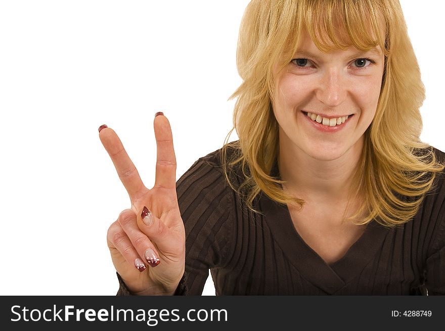 Blond woman showing a peace sign with fingers. Blond woman showing a peace sign with fingers