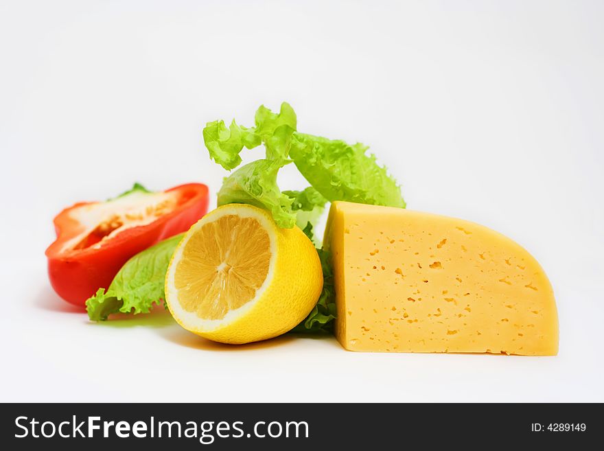 Vegetables and cheese. Isolated on white.