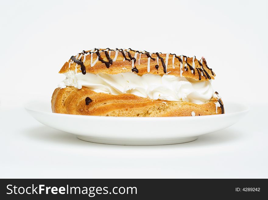 Yummy eclair. Isolated on white.