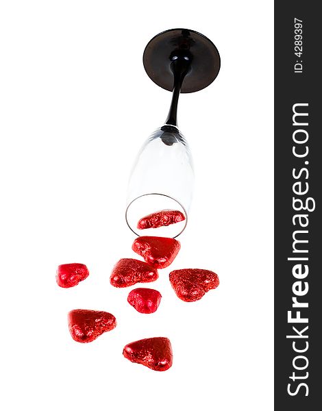 Glass and red hearts (isolated)