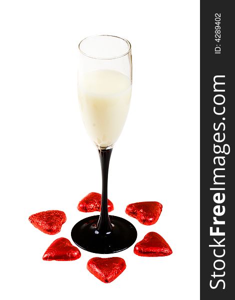 Glass with  liquor and hearts (isolated)