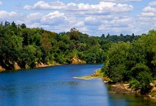 White Clouds Over A River Stock Images White Clouds Over A River Stock Images