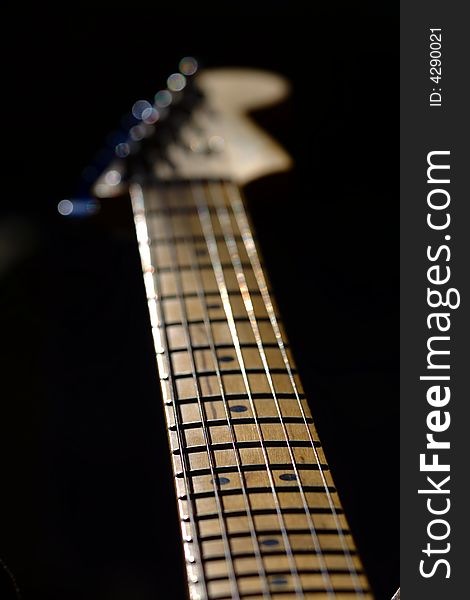 A guitar neck with used strings