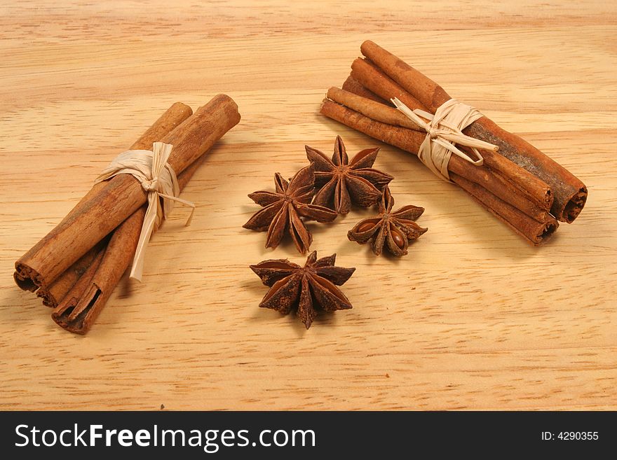 Cinnamon and star anise spice on a wood background. Cinnamon and star anise spice on a wood background