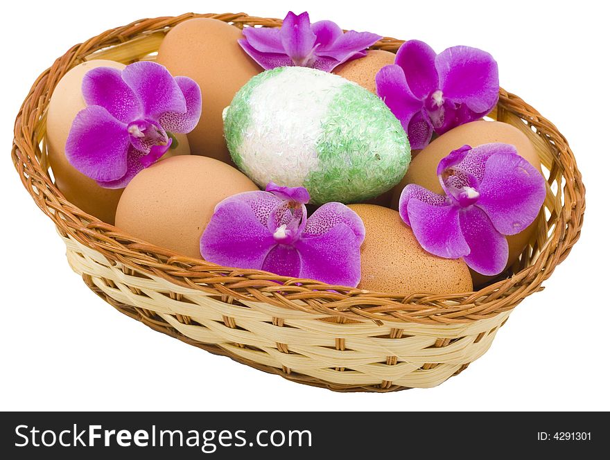 A basket of colourful easter eggs isolated on the white background