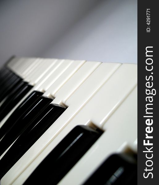 One detail of piano keyboard, play with light and shadow, black and white. One detail of piano keyboard, play with light and shadow, black and white