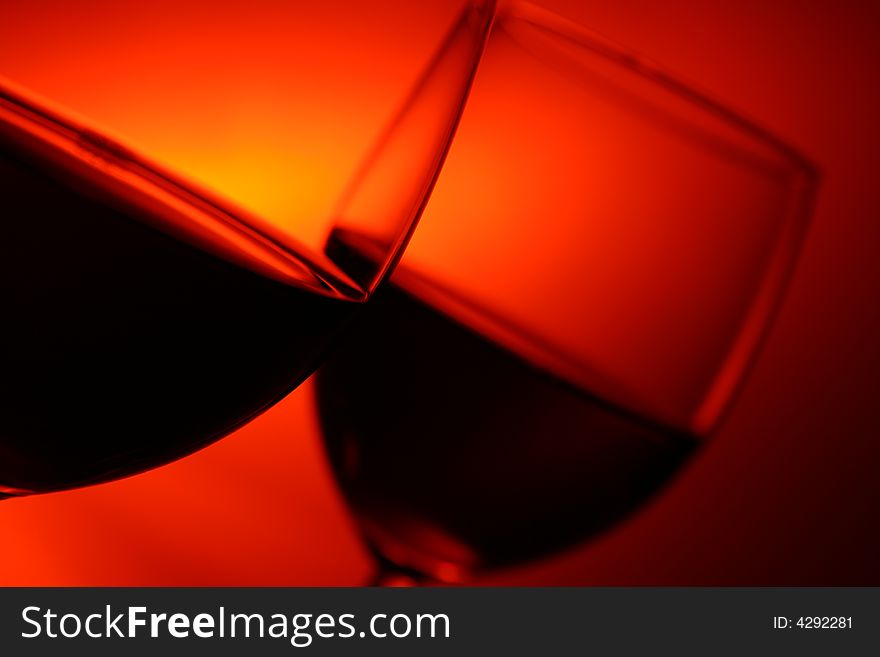 Two glasses on red background