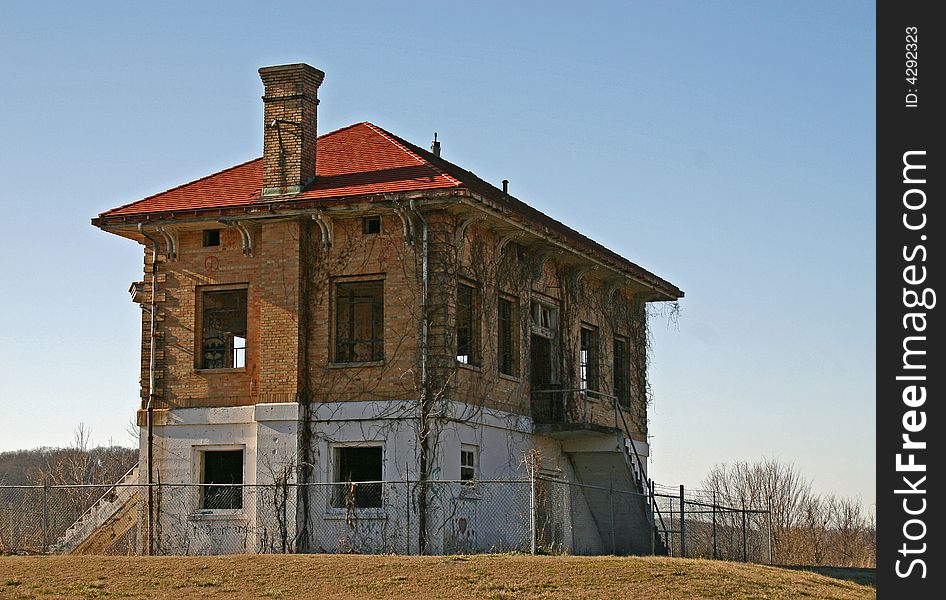 An old abandoned building and blue sky