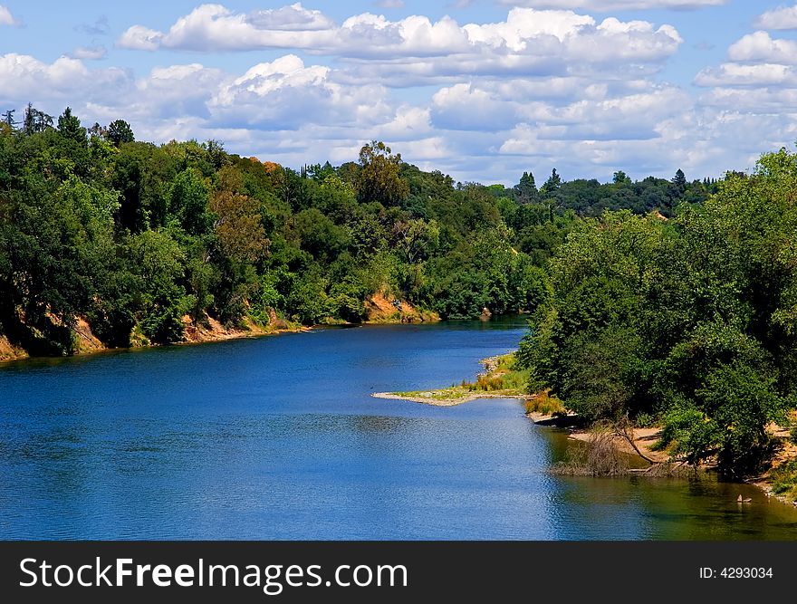 White Clouds Over A River