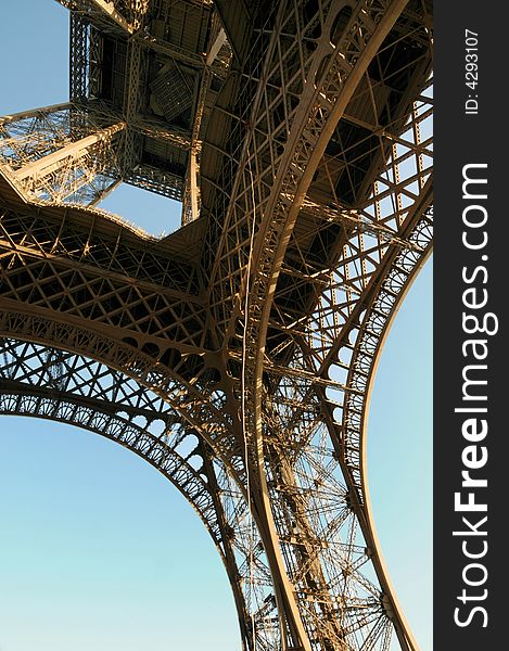 The Eiffel Tower is an iron tower built on the Champ de Mars beside the River Seine in Paris. The tower has become a global icon of France and is one of the most recognizable structures in the world.