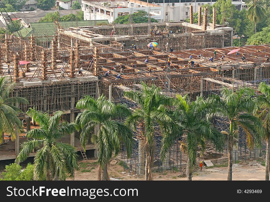 A new office construction set in the palm trees in downtown bangkok. A new office construction set in the palm trees in downtown bangkok