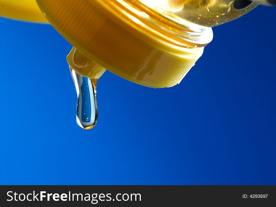 Honey pouring from a bottle. Honey pouring from a bottle