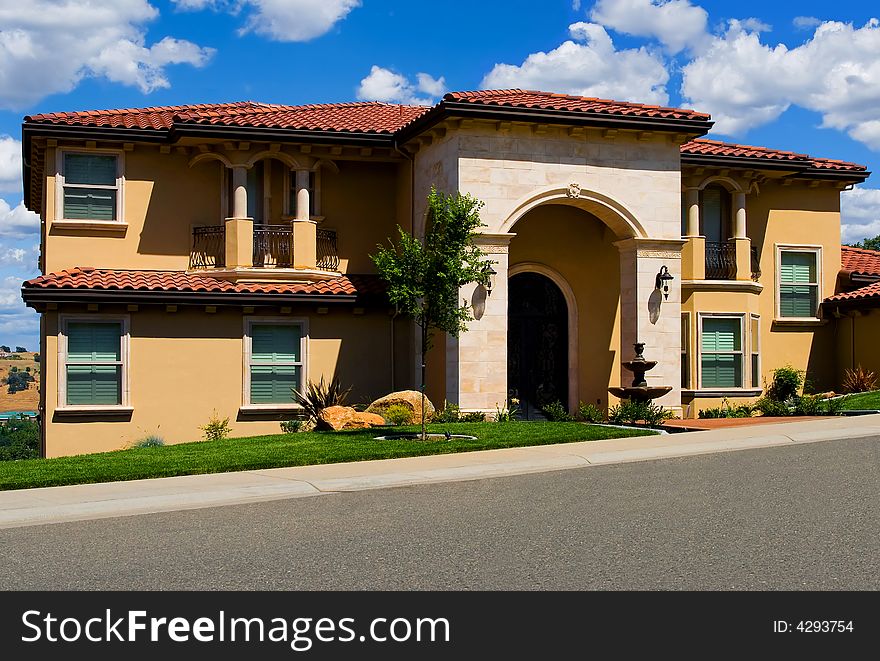 Beautiful new house with white clouds above