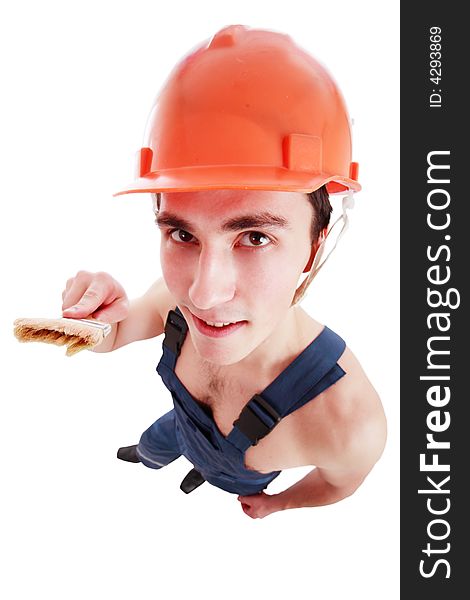 Muscular young man in a builder uniform with tools. Muscular young man in a builder uniform with tools.